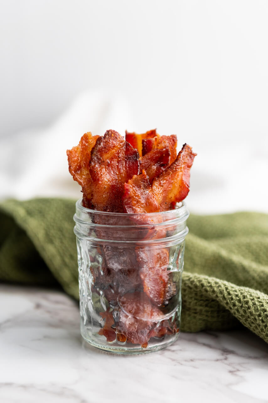 A side view of the jar of the bacon.