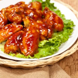 A tray of sweet and spicy wings.