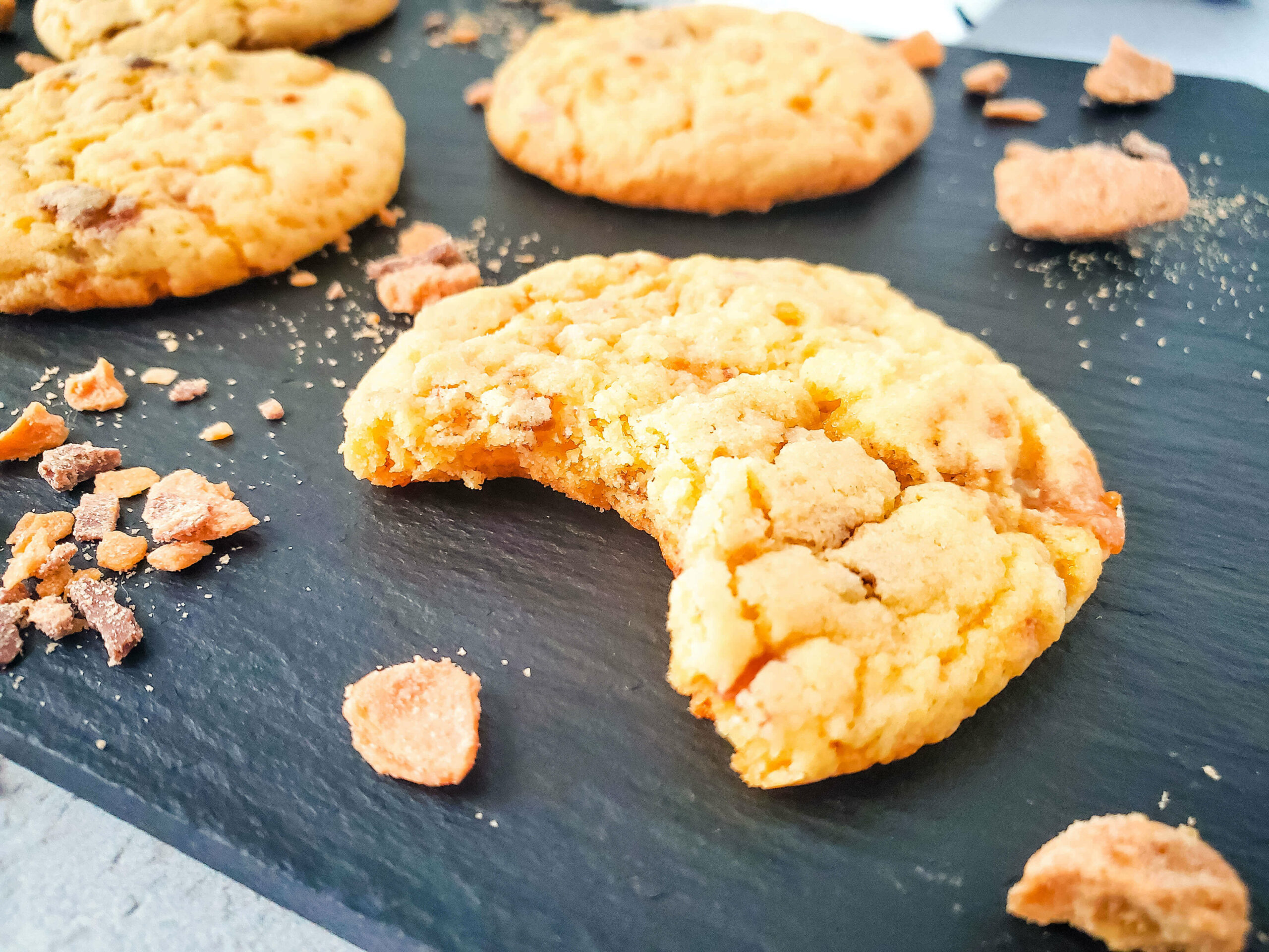 A butterfinger cookie with a bite taken out.