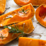 A sheet tray of cooked butternut squash.