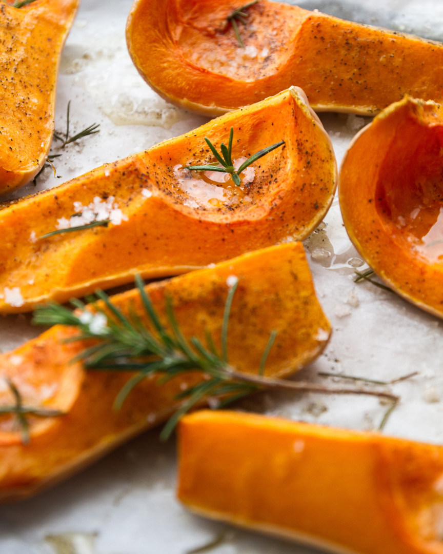 A sheet tray of cooked butternut squash.