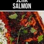 Close-up of flavorful jerk salmon garnished with fresh herbs, served alongside white rice and a lemon wedge.