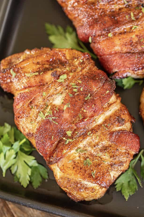 crispy and delicious bacon wrapped pork chops