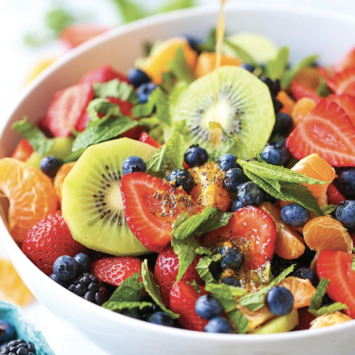 Delicious fruit salad with orange poppy seed dressing