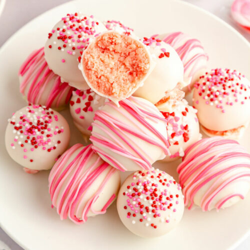A white dish of the strawberry truffles.