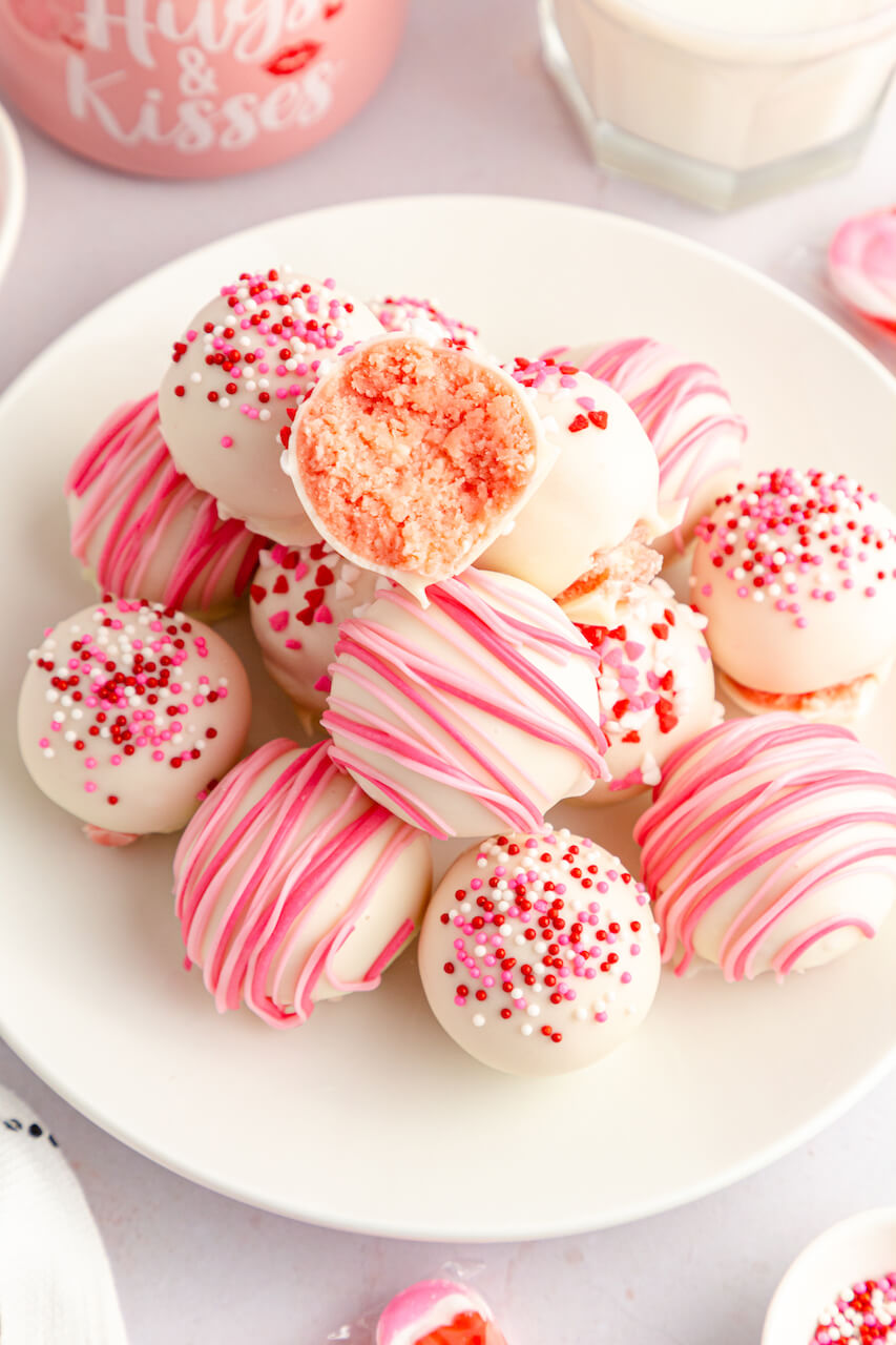 A white dish of the strawberry truffles.