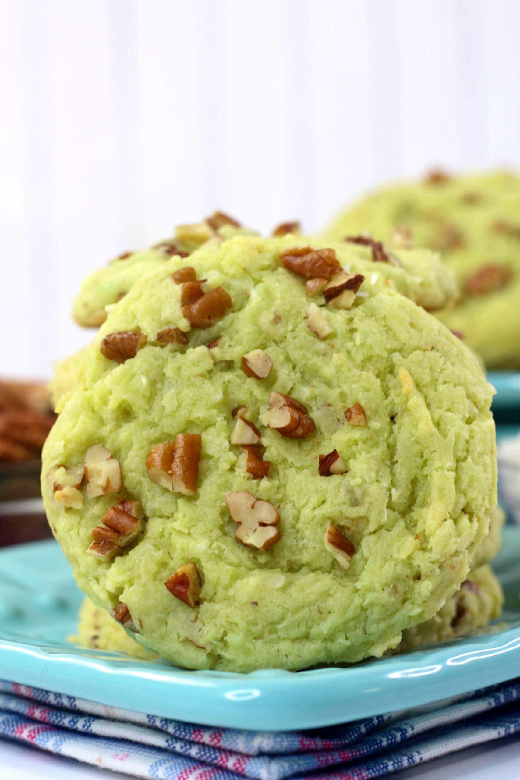 A side view of the green cookie with nuts.