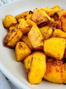 Air Fryer Butternut squash in a white bowl.