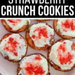 Plate of round cookies topped with white icing and red strawberry crumbs, labeled “Strawberry Crunch Cookies” at the top—these easy Strawberry Crunch Cookies are a sweet treat for any occasion.
