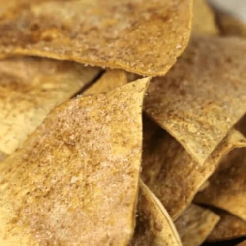 A stack of baked cinnamon tortilla chips.