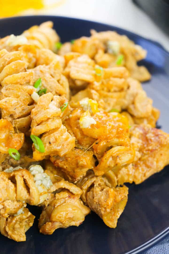 Black plate with buffalo chicken pasta.