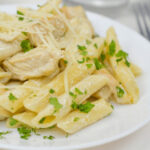 A nice close up of the pasta and chicken dish.