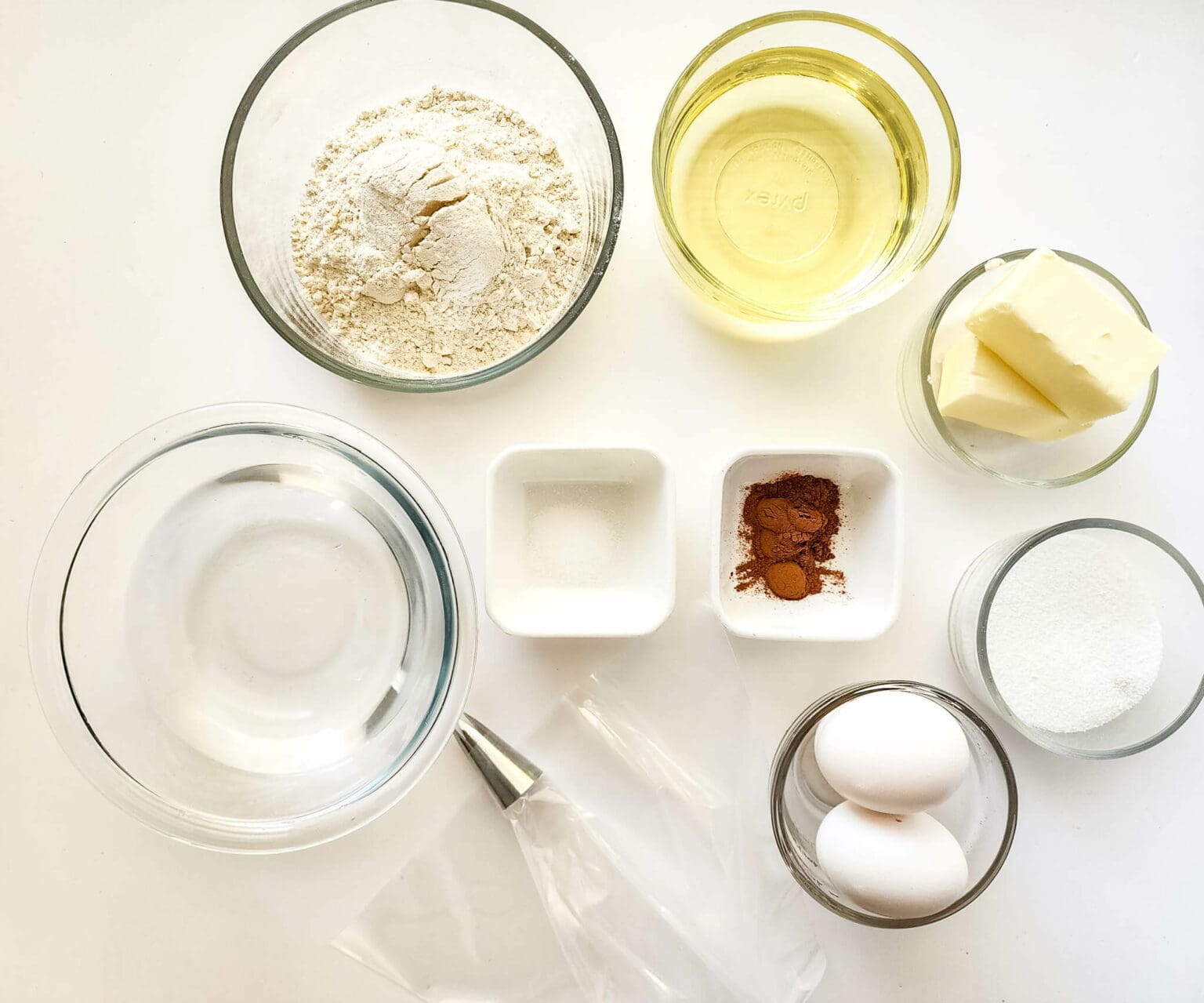 Flour, oil, butter, eggs, cinnamon and sugar.