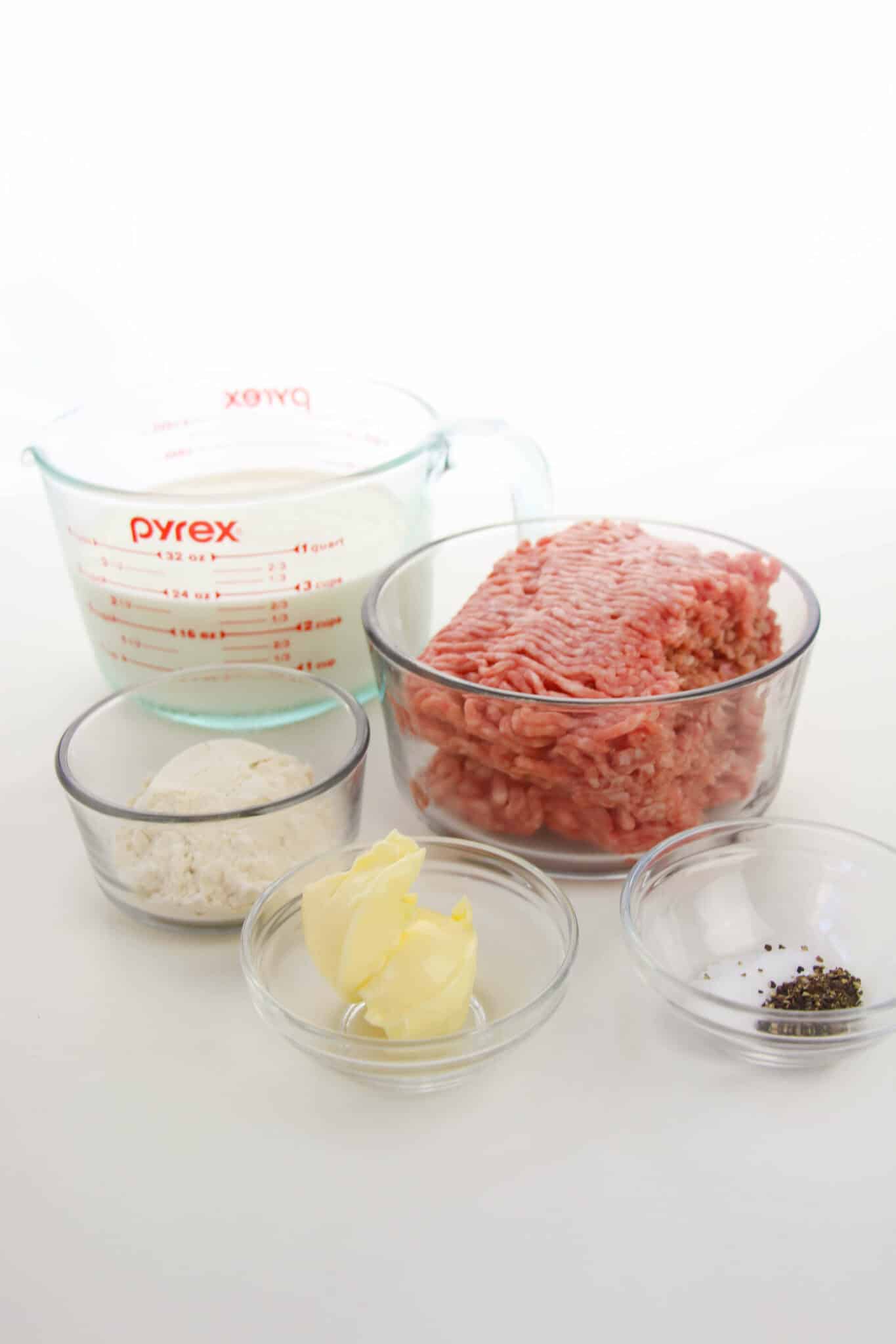 Containers of sausage, butter, flour, milk and seasoning.