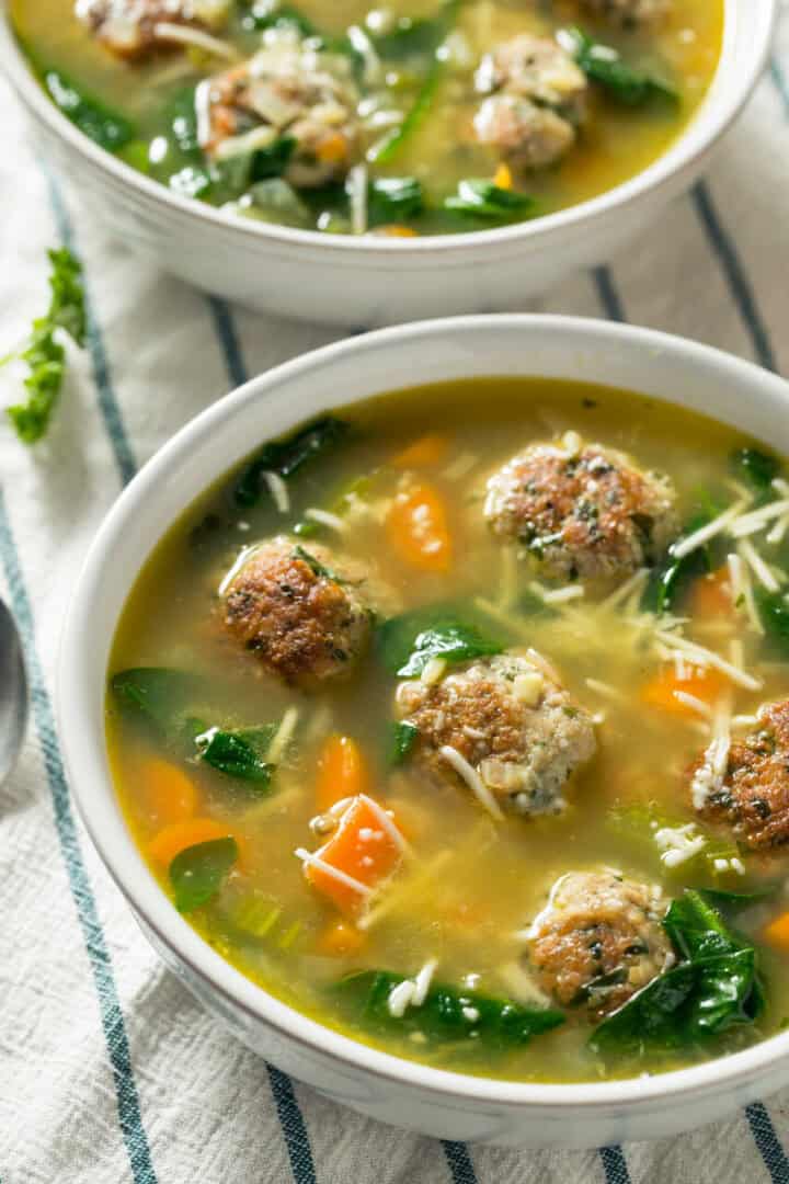 A bowl of italian wedding soup.