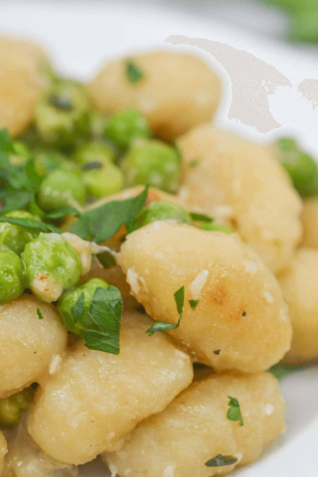 A closeup on the skillet gnocchi and peas.
