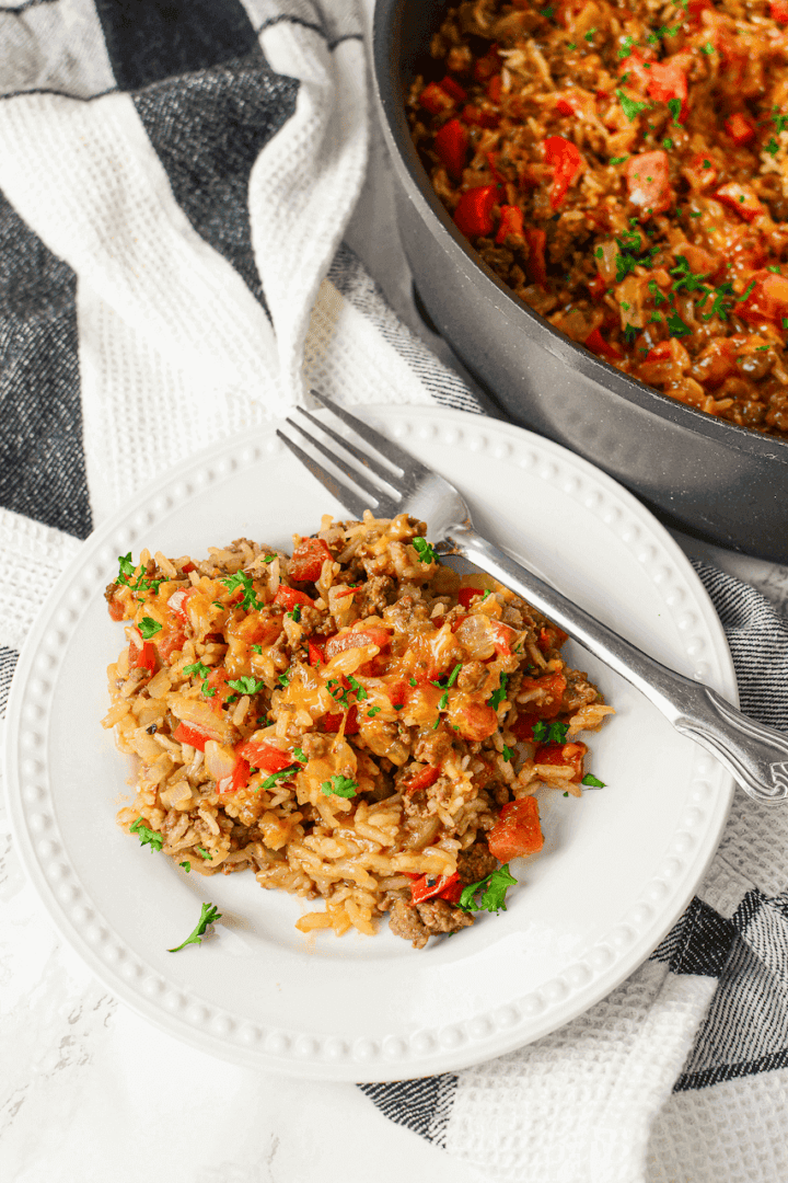 A white plate of the tex mex ground beef and rice skillet.