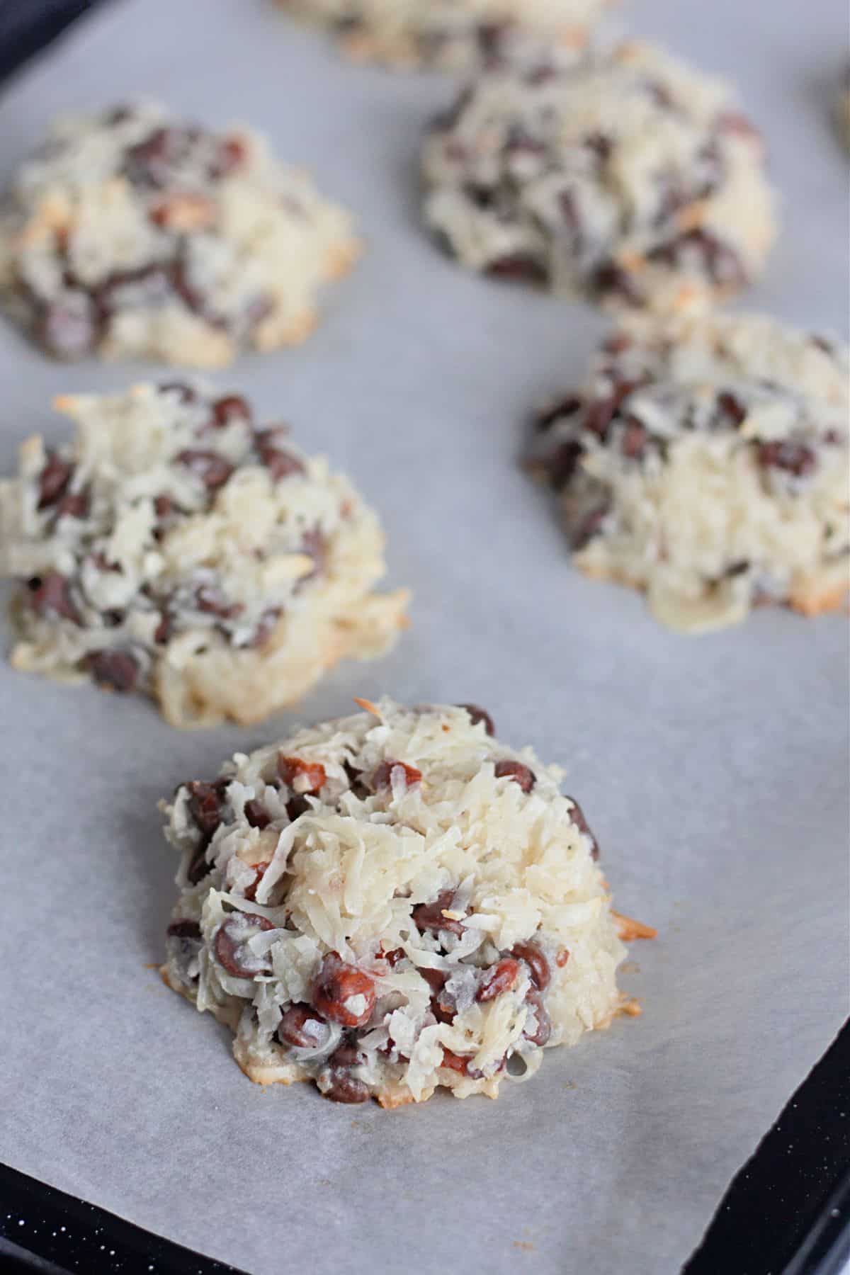 Scoops unbaked parchment-lined baking sheet.