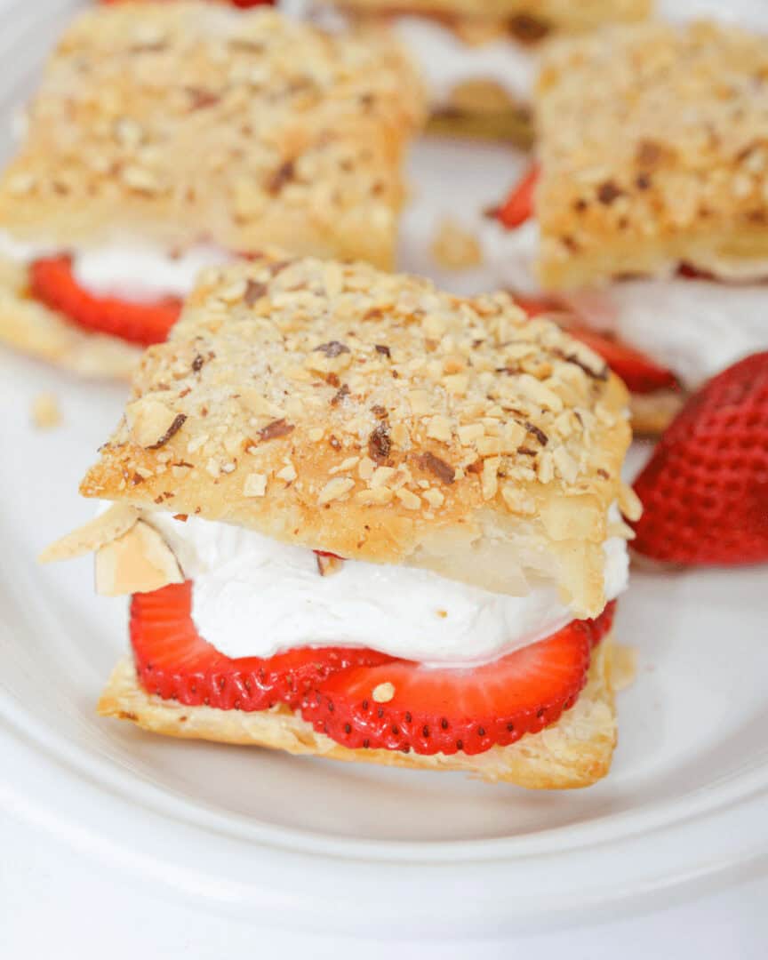 A plate of amaretto strawberry pastry stacks.