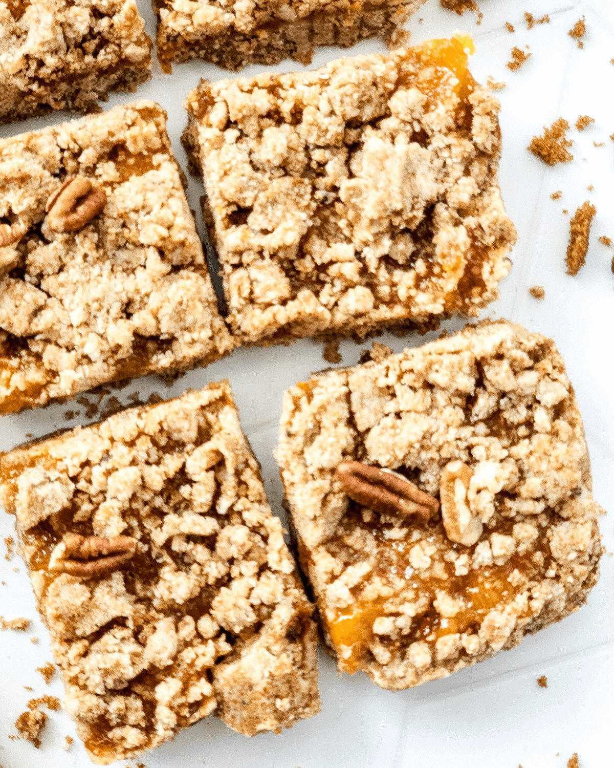 A tray of brown butter peach bars cut into squares.