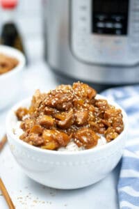 Instant pot chicken teriyaki in a white bowl.