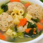 A bowl of italian wedding soup.