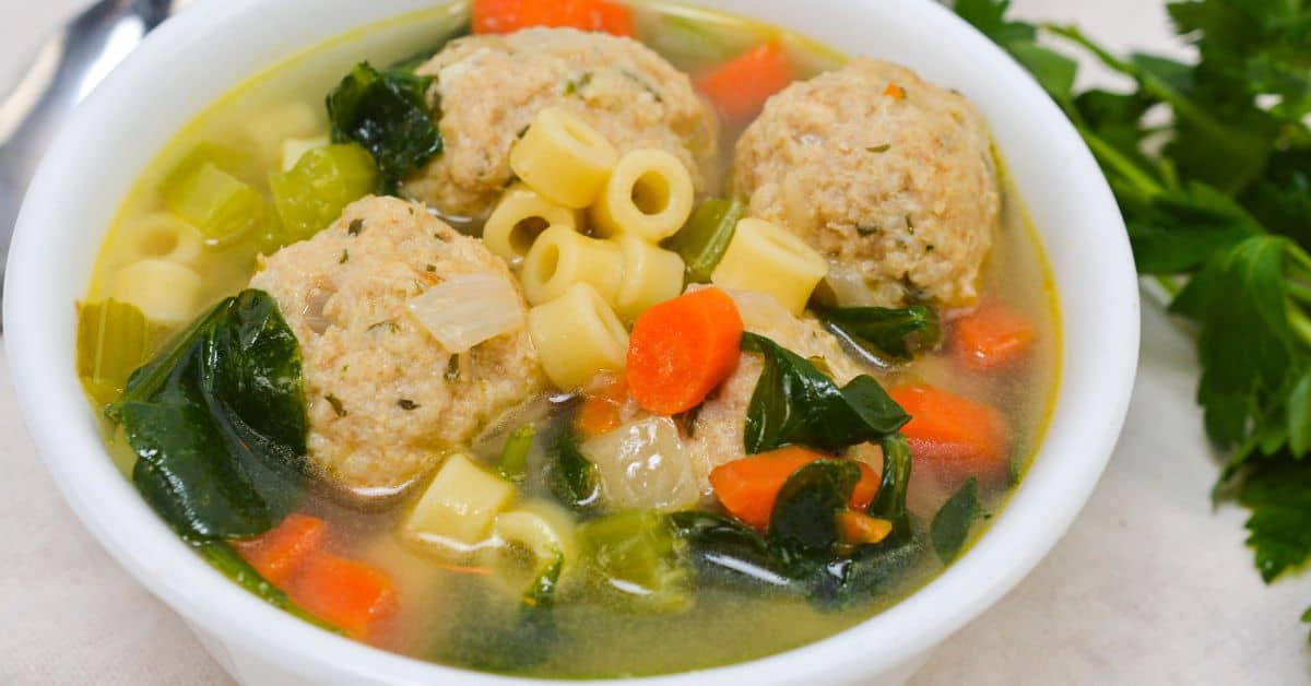 A bowl of italian wedding soup.