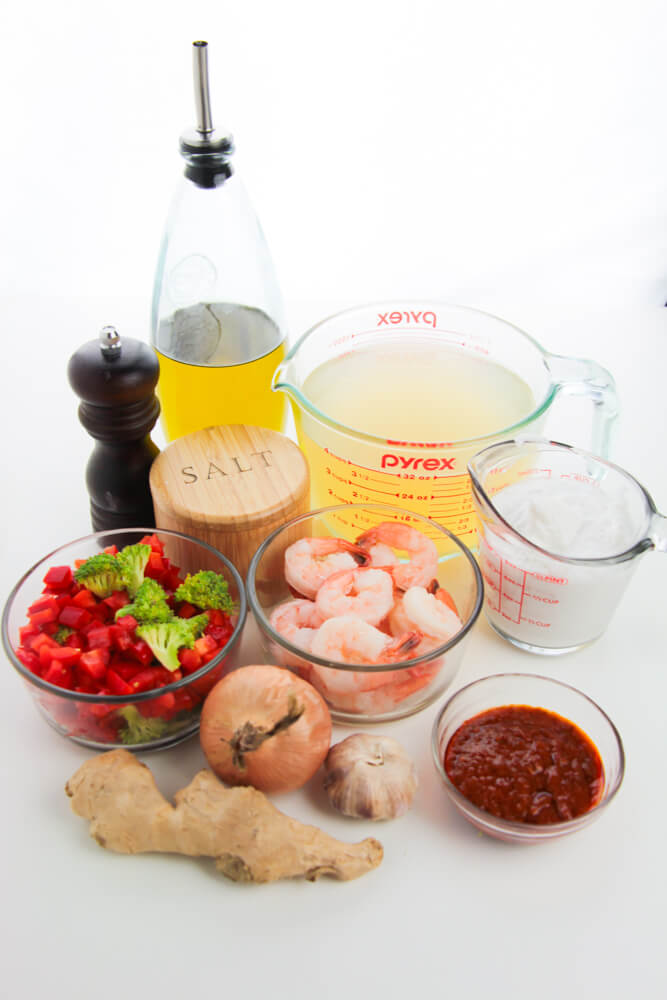 Red curry shrimp ingredients including spices, broth and sauce items.