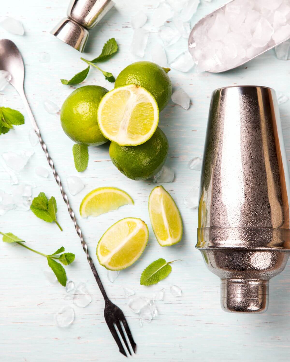 A shaker with lime for the bacardi cuban mojito.
