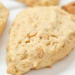 A close up on the finished golden cinnamon chip scone.