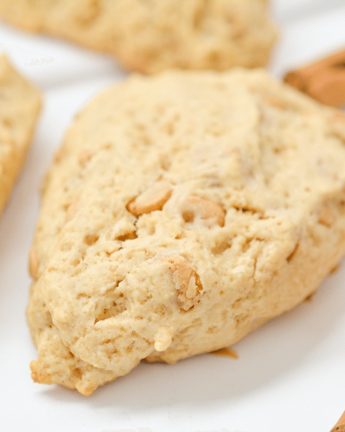 A close up on the finished golden cinnamon chip scone.