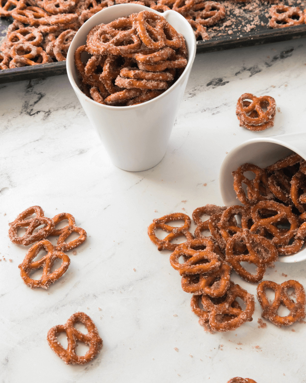 The cinnamon sugar pretzels spilling out of the container.