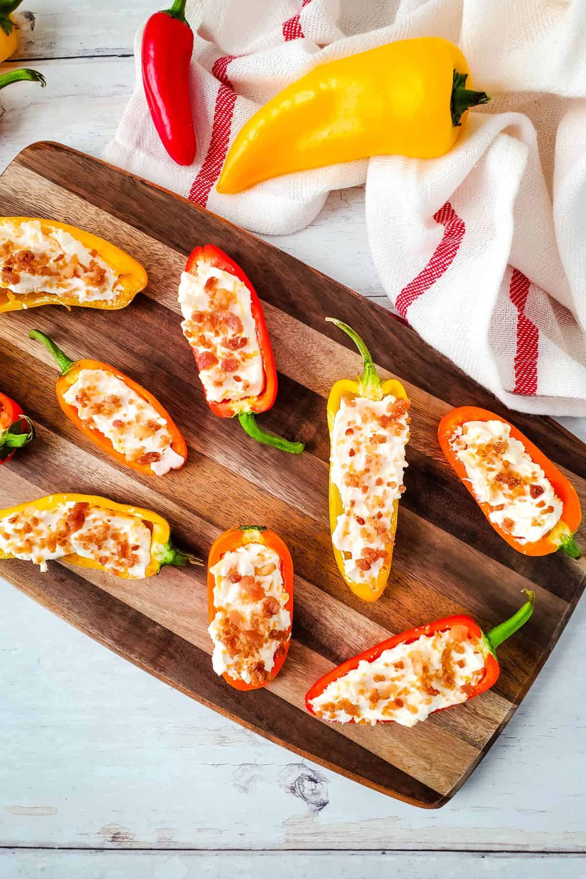 A wooden platter with the appetizer arranged on it.