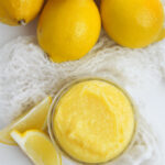 A view of the lemon filling with fresh lemons on the side.