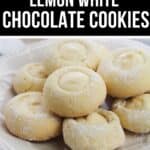 A plate of round Lemon White Chocolate Cookies dusted with powdered sugar, beautifully arranged on a white plate.