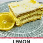 A delectable slice of Lemon Icebox Cake rests on a green plate, elegantly garnished with a lemon slice and topped with vibrant lemon zest.