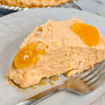 A slice of the no bake orange cream pie.