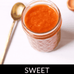 A jar of Peach BBQ Sauce is placed next to a spoon on a white surface. The text "Sweet Peach BBQ Sauce" is displayed at the bottom of the image.