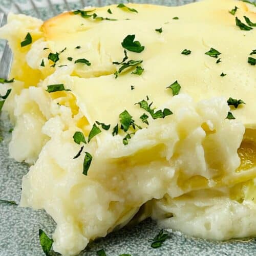 A serving of the pierogi casserole on a blue plate.