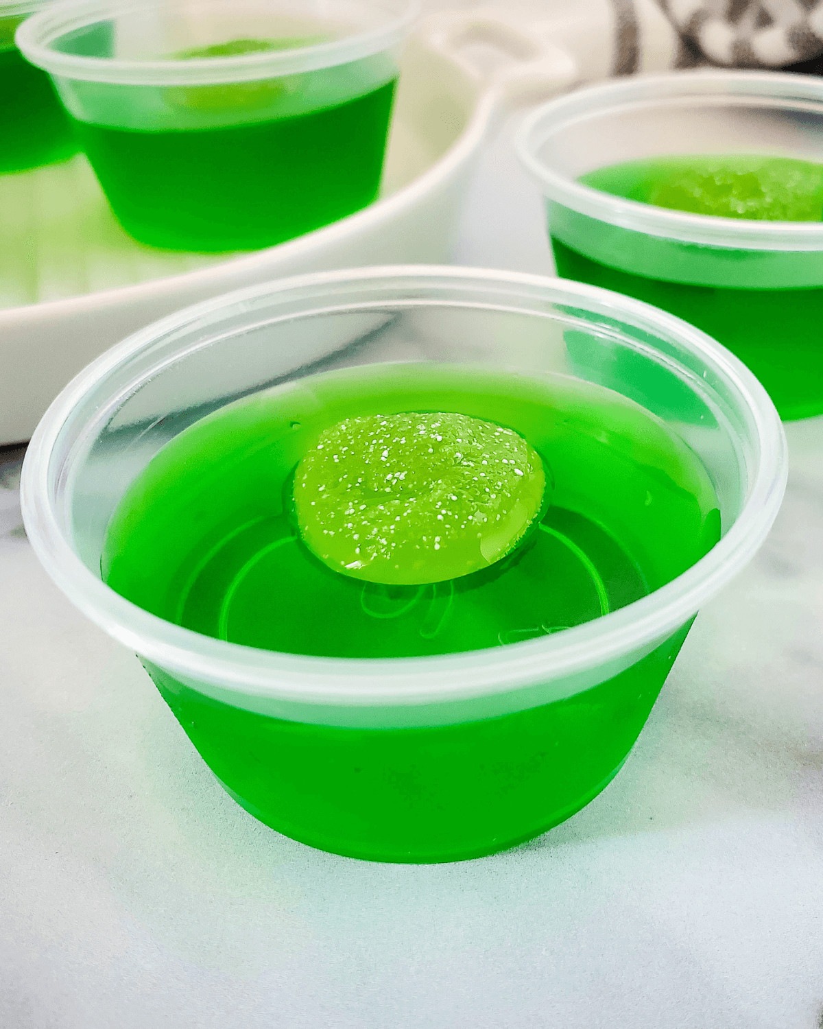 A sour apple green jello shot.