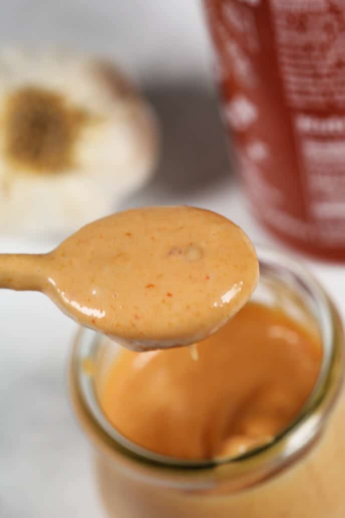A spoon of the sweet and spicy sauce.