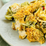 A white plate with a helping of the chicken and cheese tortellini bake.