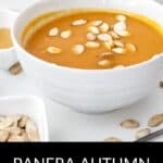 A bowl of Panera Autumn Squash Soup topped with pumpkin seeds, with a small dish of seeds and sauce nearby. Text at the bottom reads "Panera Autumn Squash Soup.