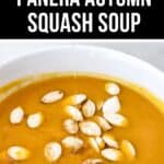 A bowl of creamy orange Panera Autumn Squash Soup topped with pumpkin seeds, with the text "Copycat Panera Autumn Squash Soup" above.