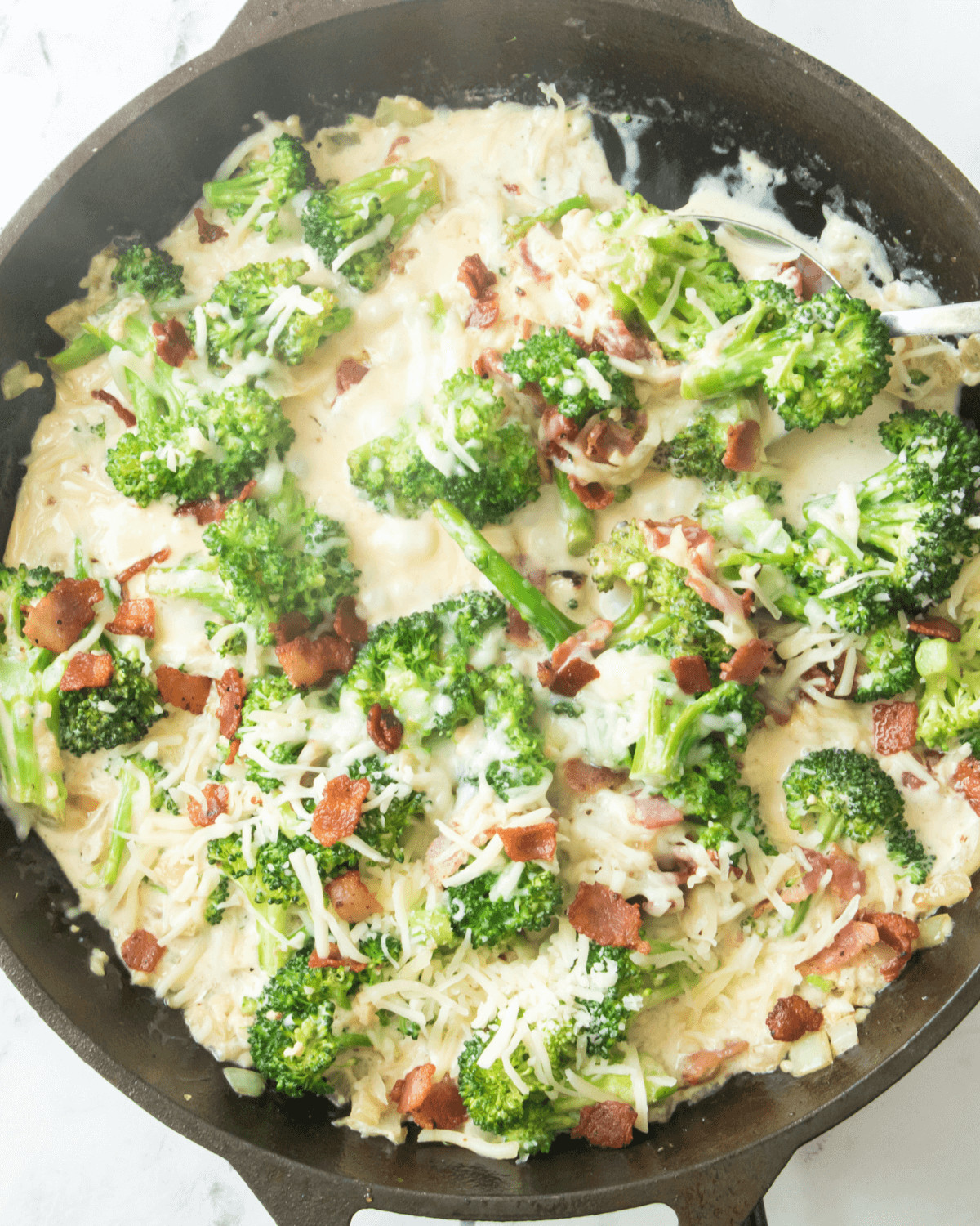 The bacon on top of the Creamy Broccoli in Parmesan Garlic Sauce.