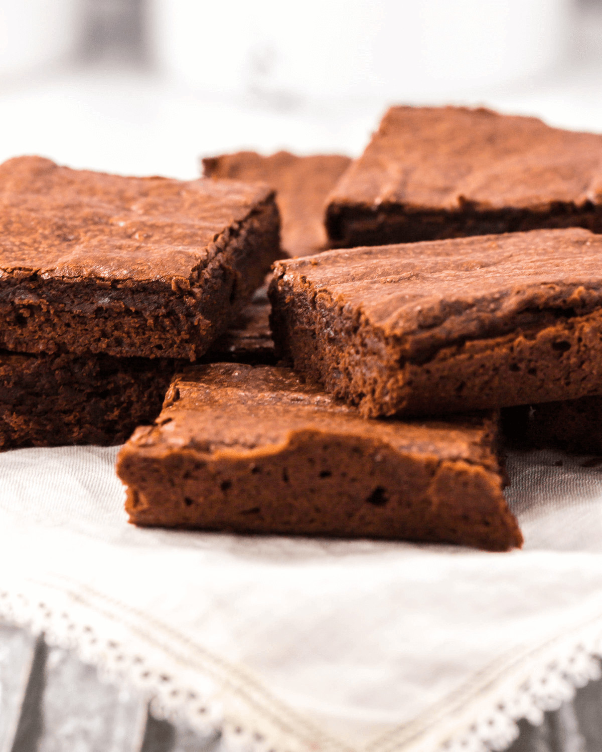 A white platter of amazing homemade brownies.