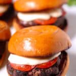 A juicy pizza burger on a bun.