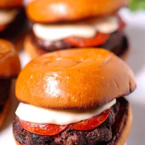 A juicy pizza burger on a bun.