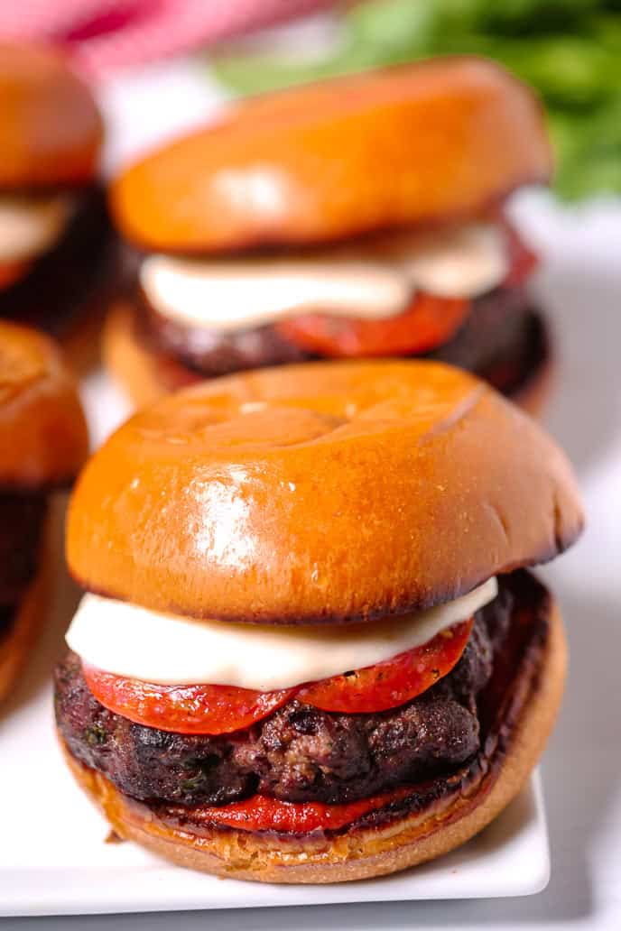 A juicy pizza burger on a bun.