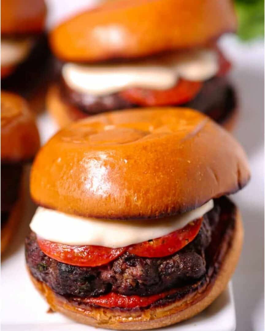 A juicy pizza burger on a bun.